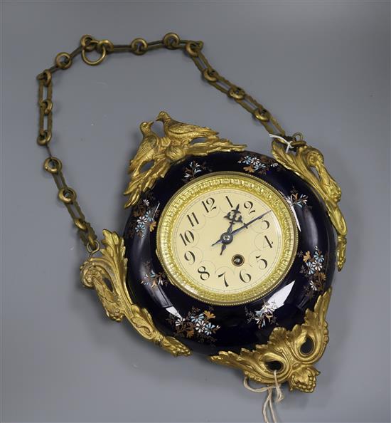 An ormolu and enamelled porcelain hanging wall clock